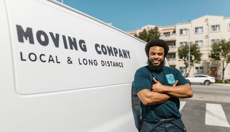 Man standing by moving van